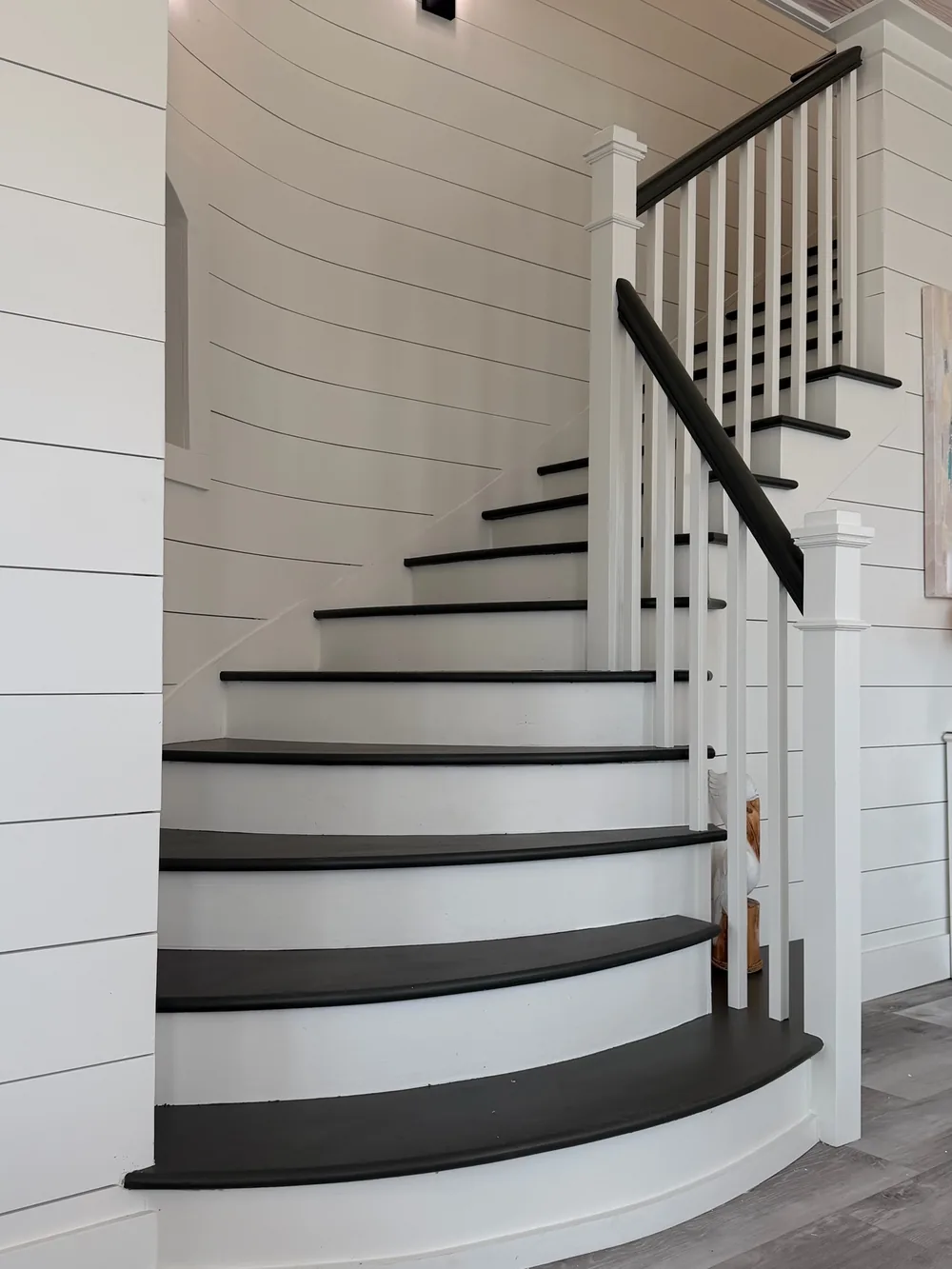 Curved staircase with a painted finish