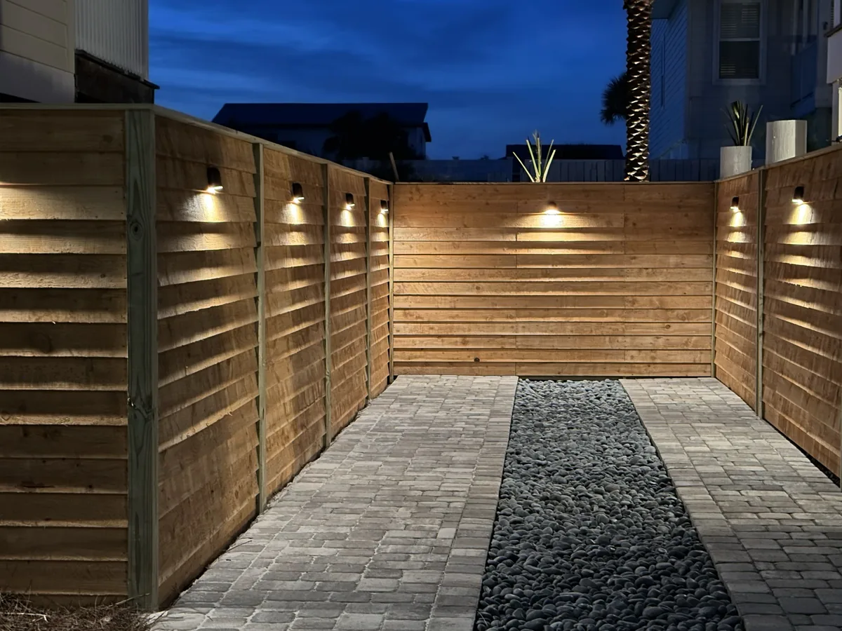 Outdoor area with pavers and lighting
