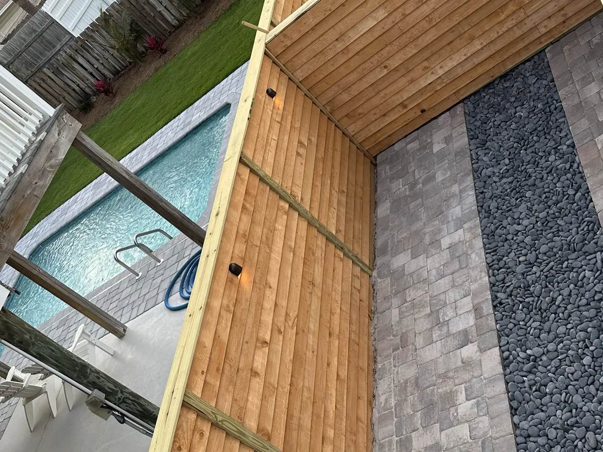 Outdoor area with pavers and a pool